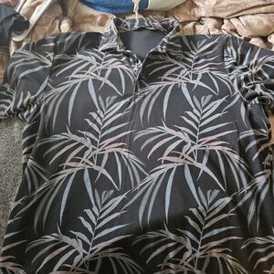 Travis Mathew Black Polo with Blue and Pink Leaf Print